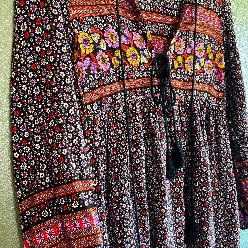 Black floral long sleeve boho maxi dress with purple and gold floral detail